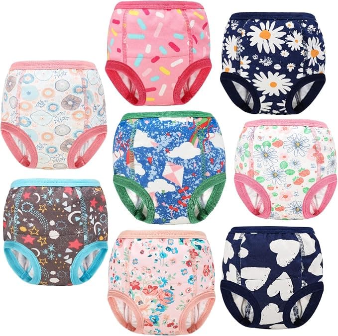A grid display of eight colorful pattern toddler training pants with elastic trim.