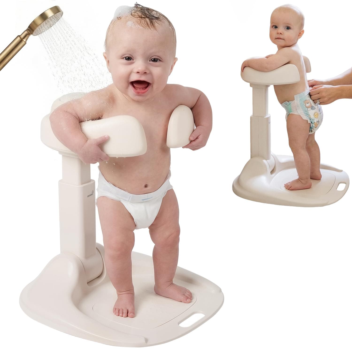 A toddler standing on a beige plastic bath stand with supportive armrests while being rinsed with a shower head.